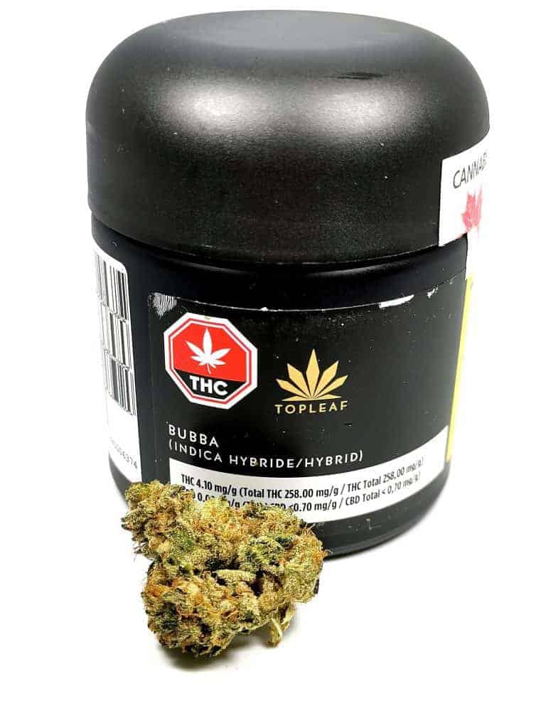 bubba strain review made by top leaf picture of flower and container