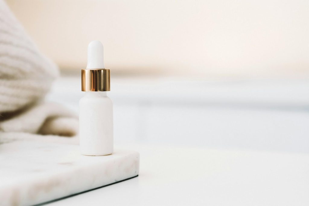 white and gold small bottle - featured image