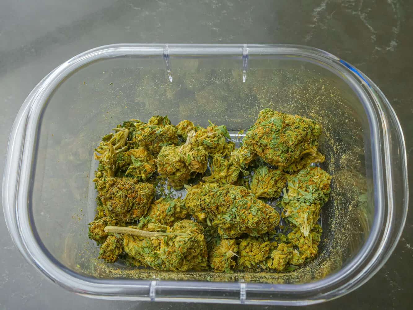 cannabis flower on a glass container
